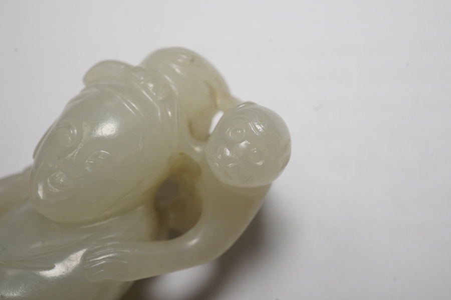 A Chinese white jade figure of a monkey trainer, 18th century